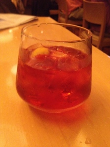 Central's tasty Negroni is  presented in a contemporary glass with an elegant corkscrew garnish